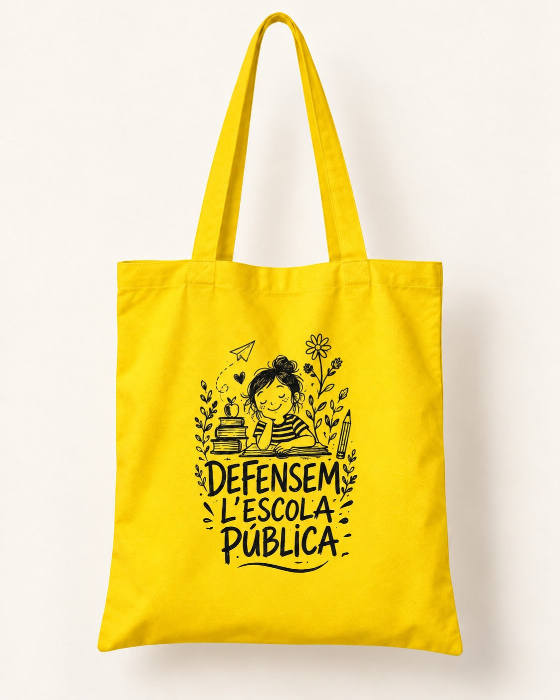 Bossa de tela groga “Defensem l’escola pública” — vista frontal
